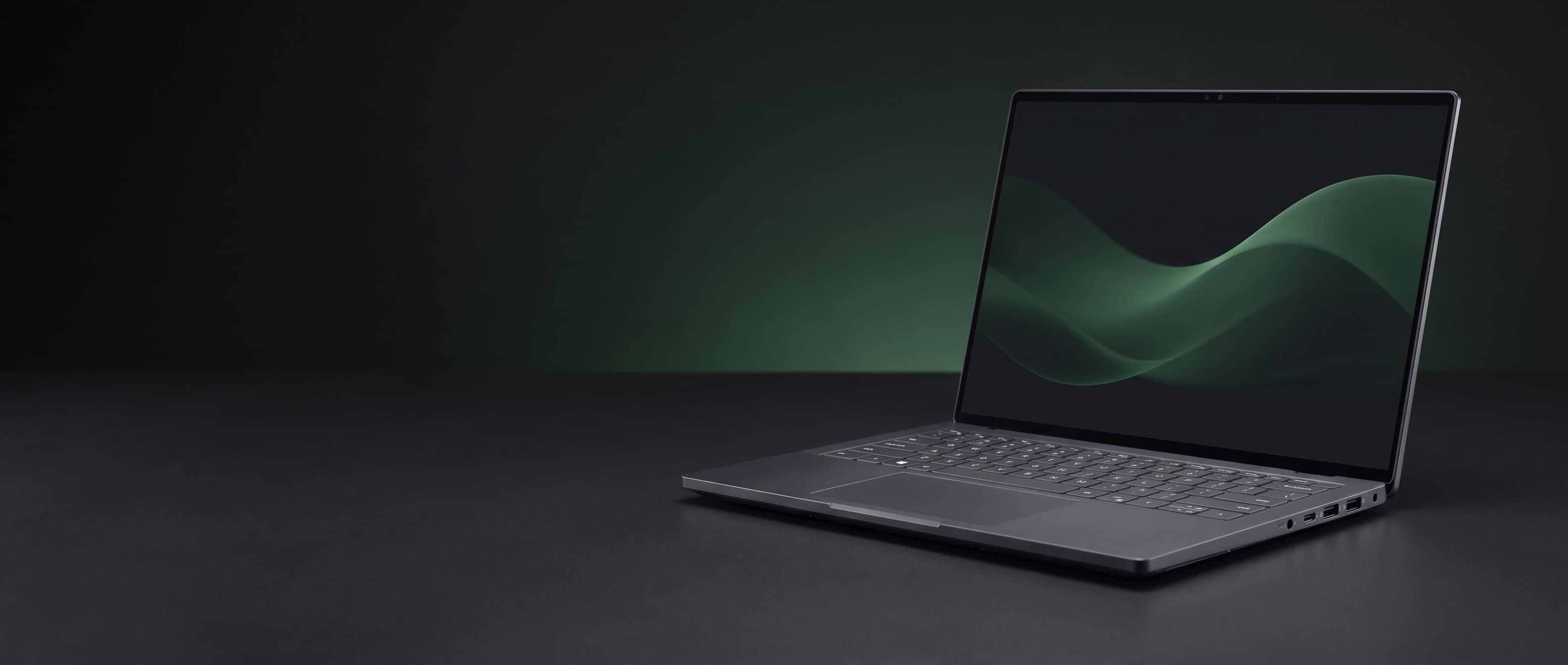 Notebook biznesowy Dell Pro na ciemnym tle z zieloną poświatą